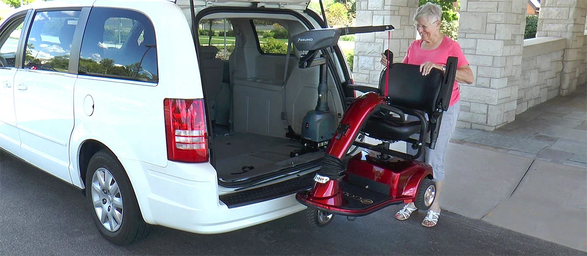 Bruno Curb-Sider Scooter Lift being loaded into back of van