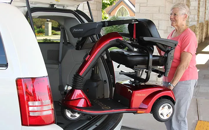 Bruno Curb-Sider Scooter Lift being loaded into back of van