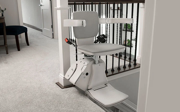 stair lift at the top of staircase