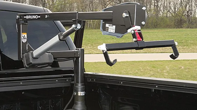 out rider scooter lift passenger side model in the box of a pickup truck