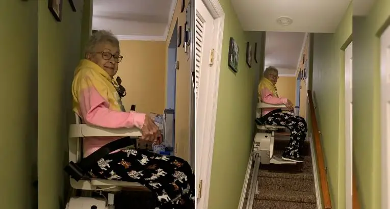 a woman riding an indoor stair lift