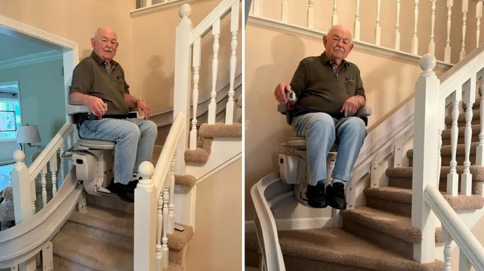 a man riding a curved stair lift