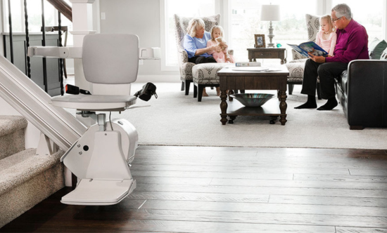 stair lift with family sitting behind in the living room