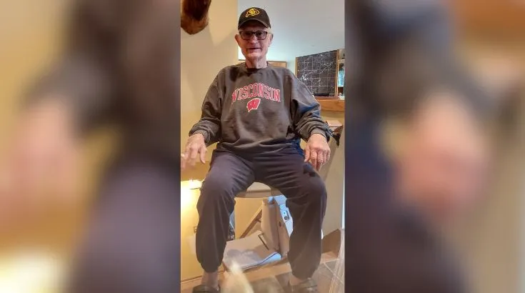 a man riding an indoor stair lift